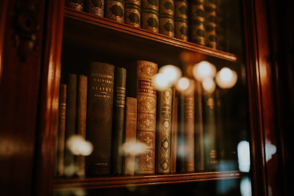 Rows of old law books on a shelf